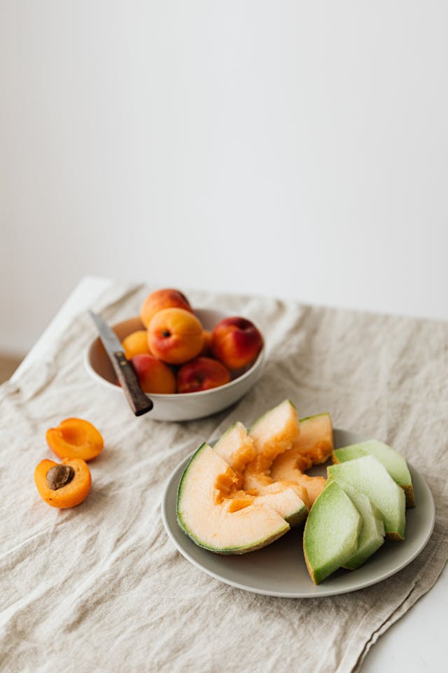 plates of fruits on a table